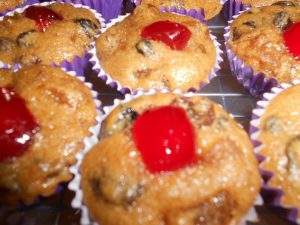 Lavender fruit puddings topped with glazed cherries, showcasing Teatrick Lavender Estate's lavender-inspired baked treats.