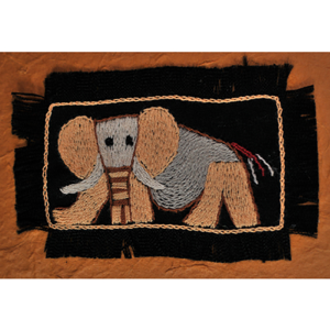 Handcrafted elephant textile artwork featuring embroidered details on black fabric, available at Teatrick Lavender Estate gift shop.