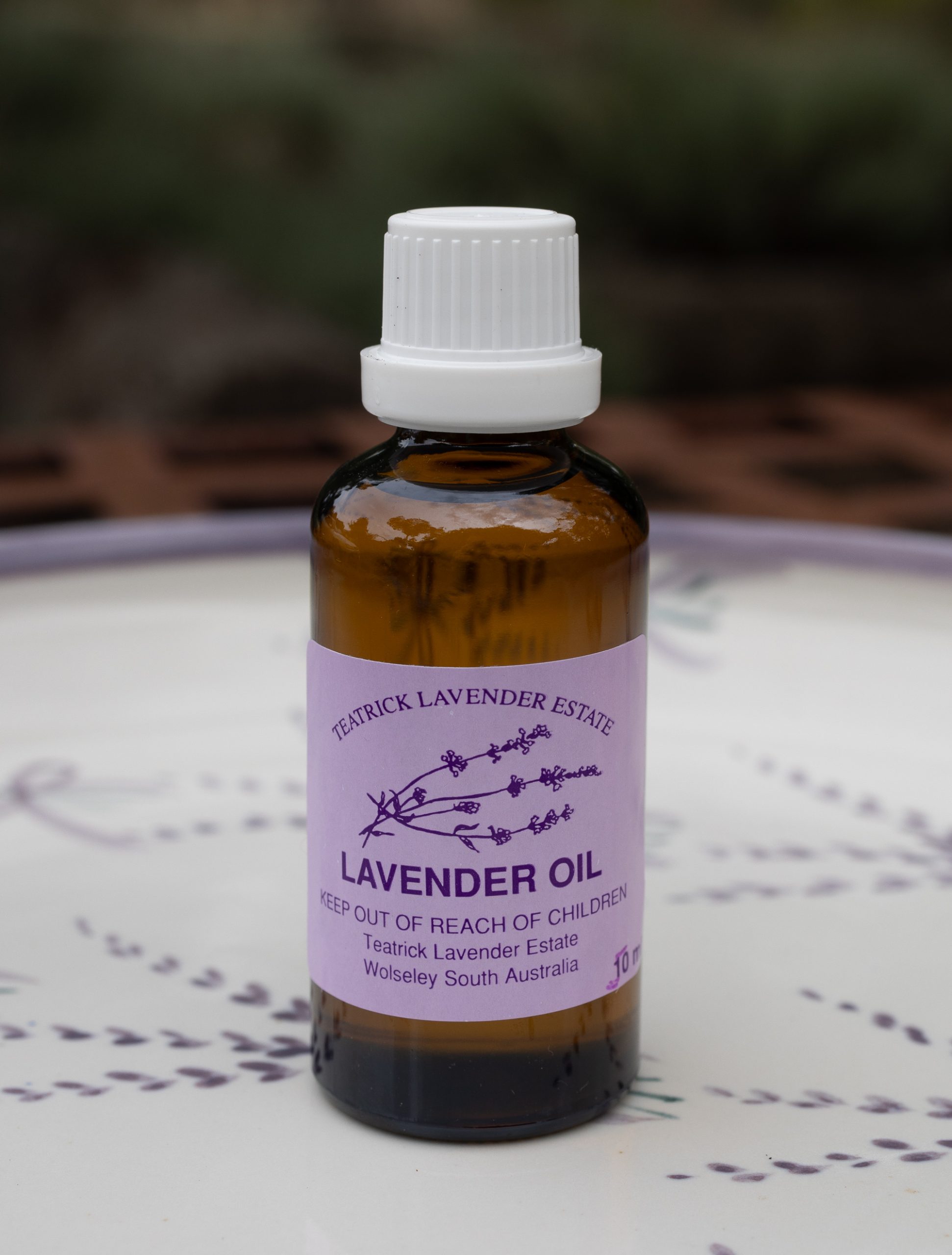 TLE2026-64 Pure lavender essential oil from Teatrick Lavender Estate presented in an amber glass bottle